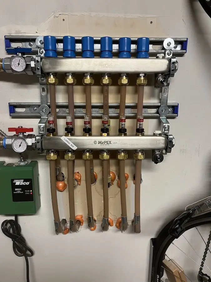 Plumber performing Water Heater Repair at a residential property in Lake Stickney